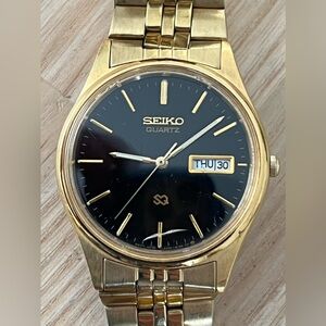 Seiko SQ Vintage Men’s Watch Black Dial Gold-Tone Bracelet Day Date Window